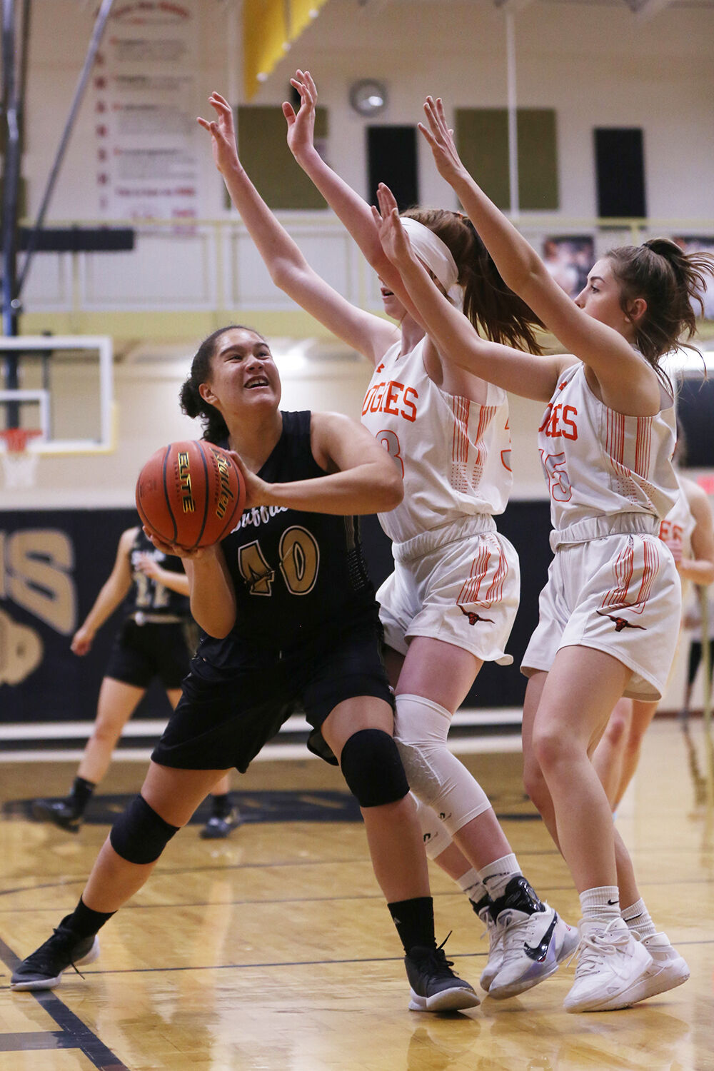 Danica Boyce pushes under two Newcastle defenders